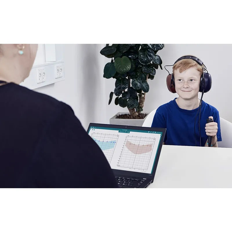 Interacoustics Luna Audiometer testing a boy. Shop now at Zone Medical.