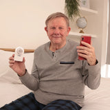 Safey Clinic Spirometer Lite with an old man holding it. Shop now at Zone Medical.